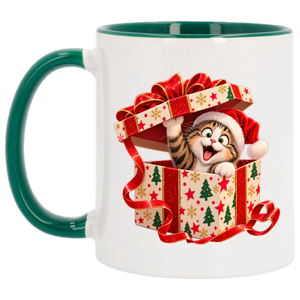 Mug Noël chat surprise : un chat tigré en bonnet de Père Noël jaillit tout, sur un mug de Noël à anse et intérieur verts